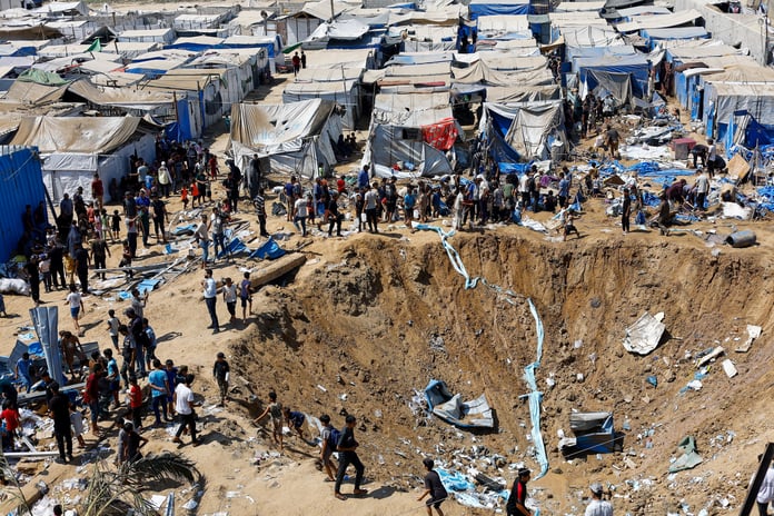 Palestinians inspect overnight Israeli strike on medicine warehouse at Al-Aqsa Martyrs Hospital, Deir el-Balah, Gaza