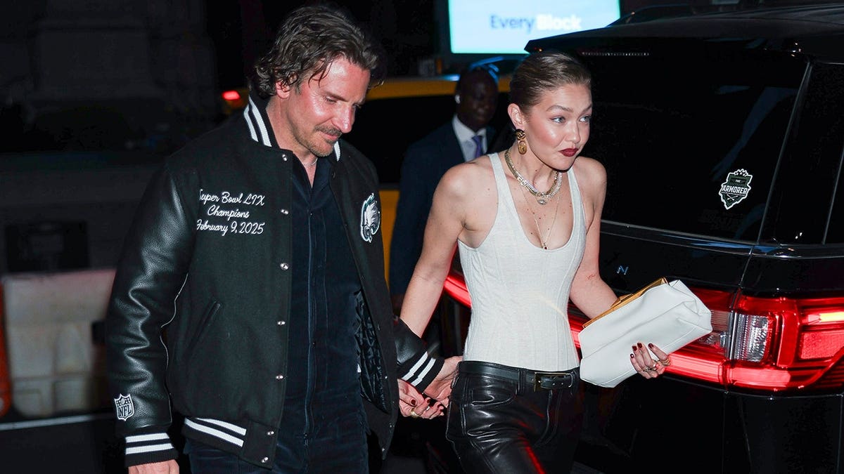 Gigi Hadid and Bradley Cooper wearing matching rings in Paris August 2026