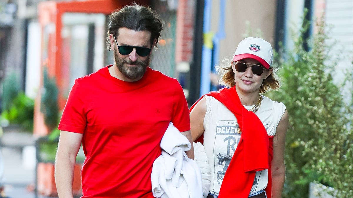 Gigi Hadid and Bradley Cooper walking together in Paris August 2026
