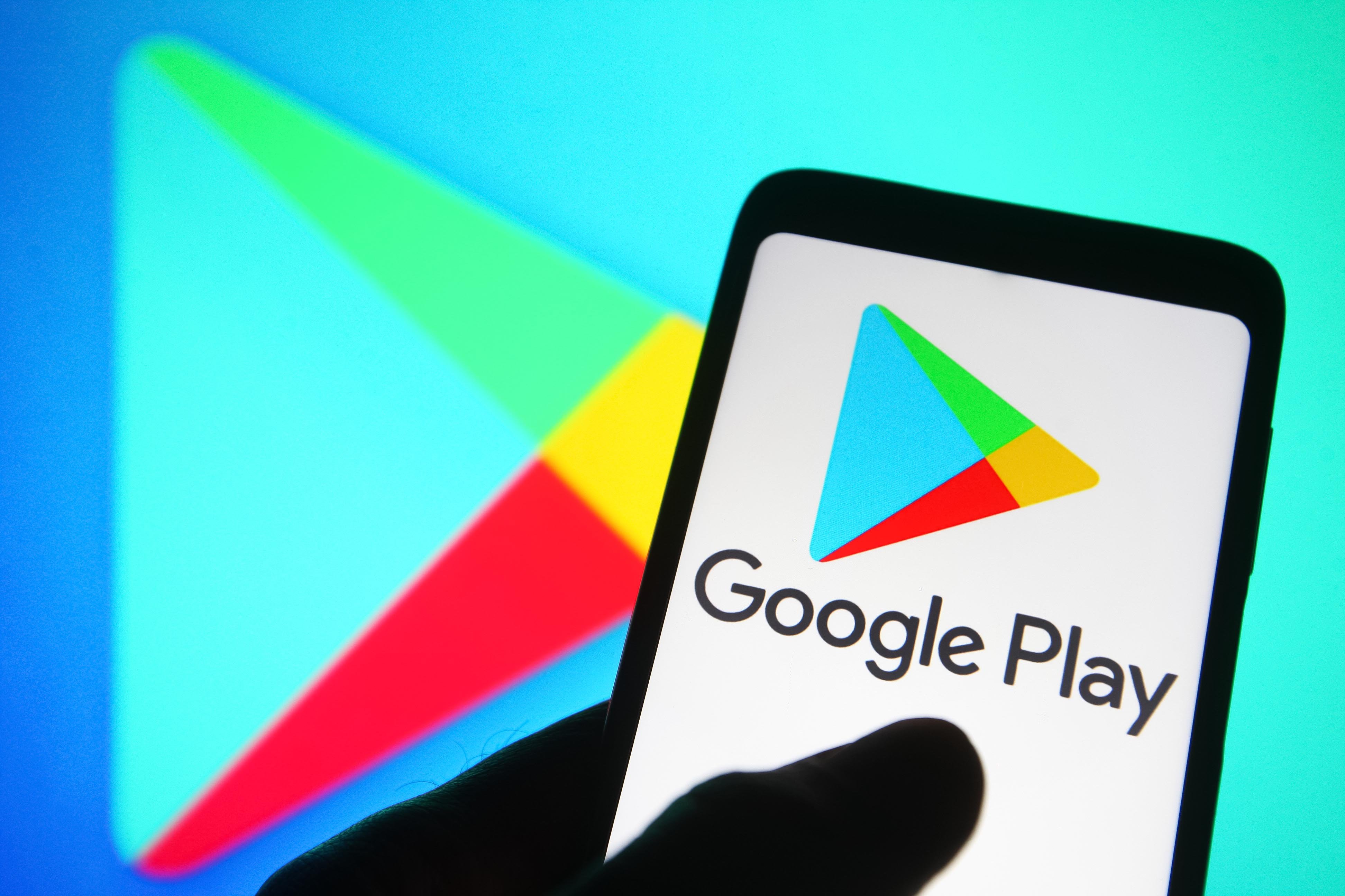 Google Play Store logo on a smartphone screen showing Android app marketplace