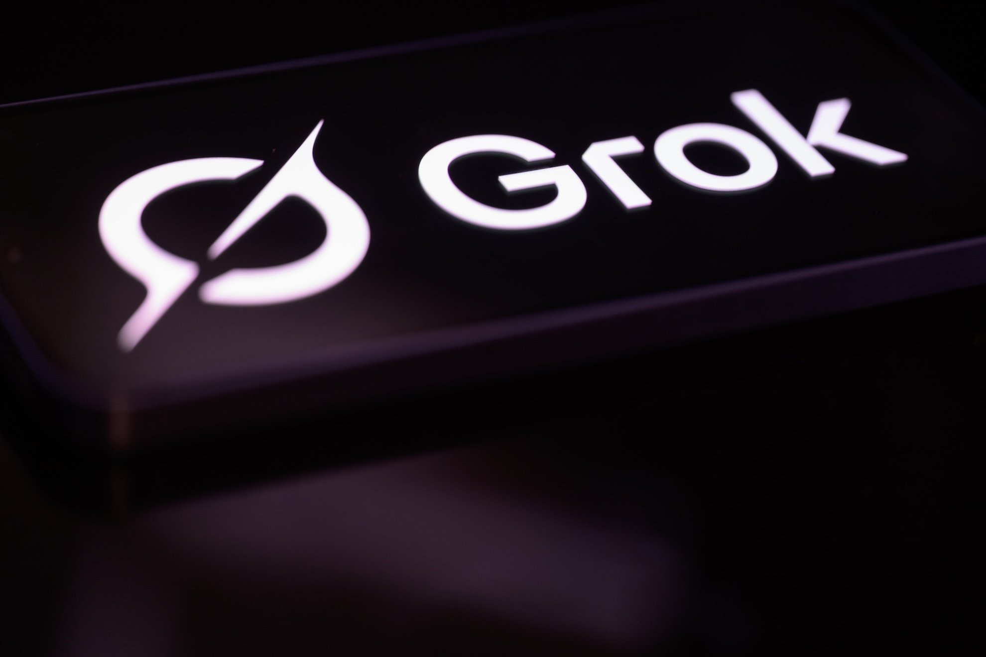 Grok AI chatbot logo displayed on mobile phone screen xAI 2026