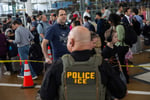 ICE officers conduct enforcement at US airport 2026 as immigration detentions reach record high