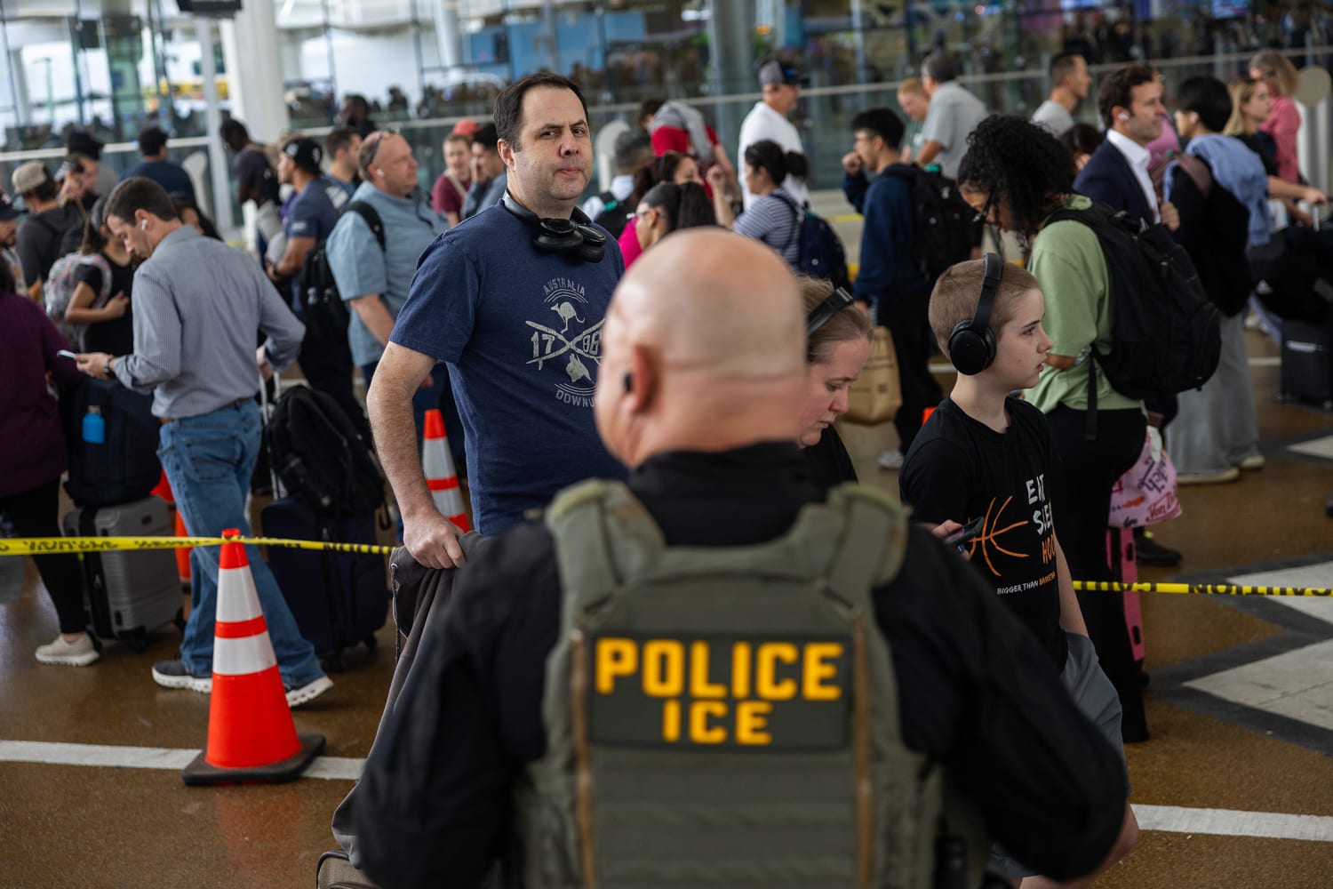 ICE officers conduct enforcement at US airport 2026 as immigration detentions reach record high