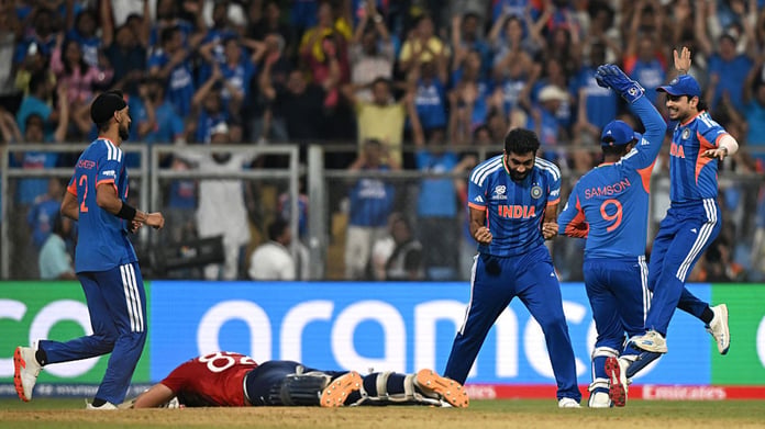 India players celebrate the final wicket as an England batter lies on the pitch during the T20 World Cup 2026 semi-final at the Wankhede Stadium in Mumbai