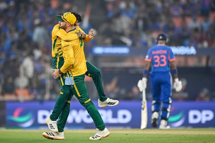 Keshav Maharaj and Aiden Markram celebrate a wicket in the India national cricket team vs South Africa national cricket team Super 8 match in Ahmedabad