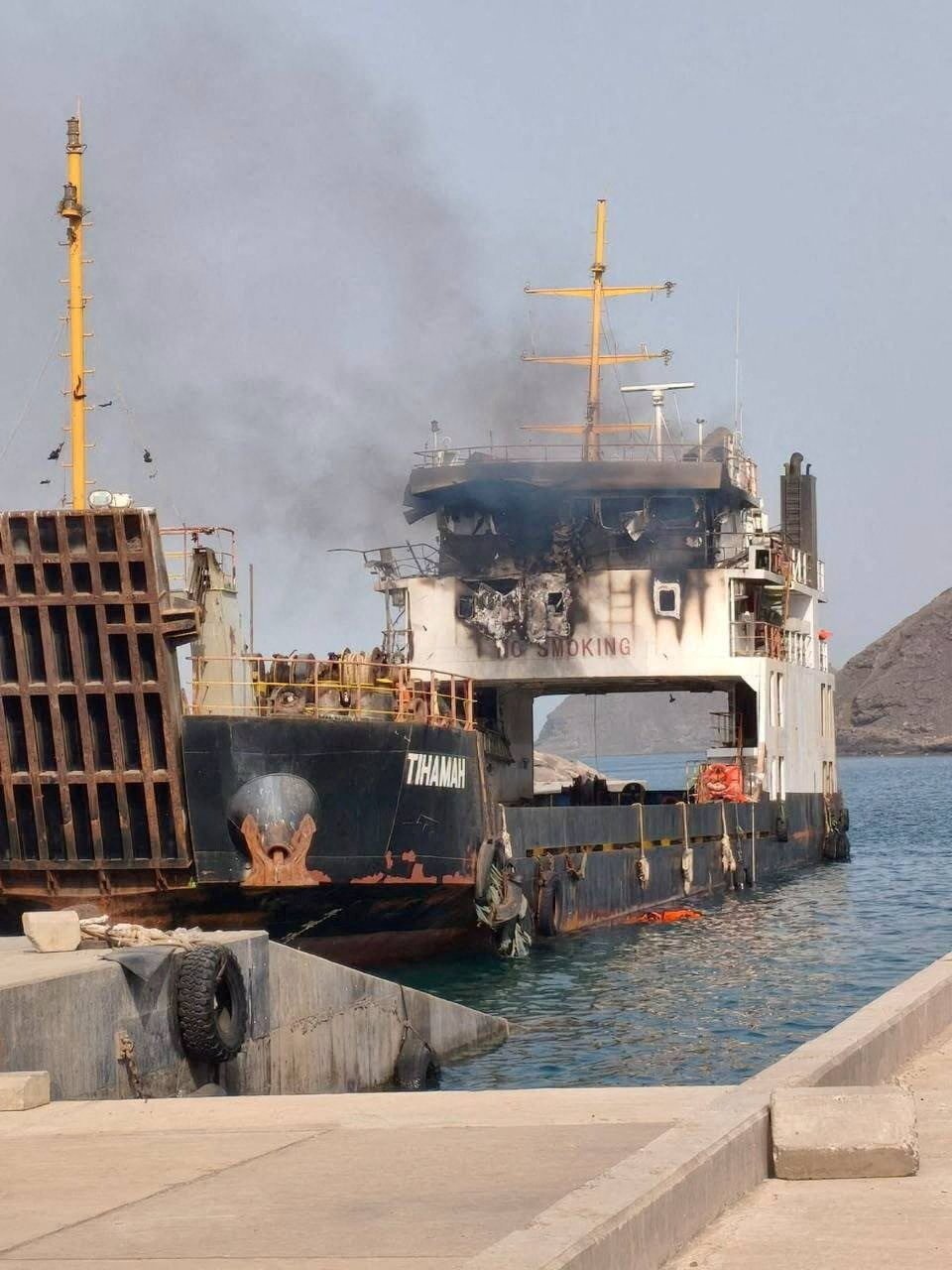 Commercial shipping in the Gulf of Oman under US Navy blockade enforcement as Vela Nova containership is disabled August 11 2026