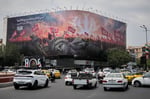 Fallen Statue of Liberty billboard in Tehran reflecting Iran's hardening stance against US demands over Strait of Hormuz