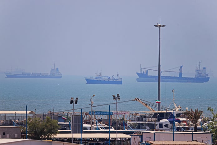 Commercial vessels anchored in Bandar Abbas along the Strait of Hormuz as the US naval blockade of Iran continues