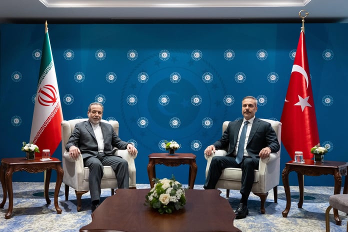 Turkish Foreign Minister Hakan Fidan and Iranian Foreign Minister Abbas Araghchi seated for bilateral talks in Istanbul