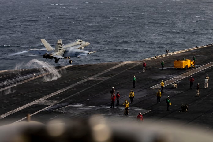F/A-18E Super Hornet launches from the flight deck of the USS Abraham Lincoln during Iran war operations in the Persian Gulf