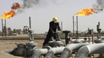 Iraqi oil worker at a refinery near Basra as Turkey and Iraq sign the Kirkuk-Ceyhan pipeline deal