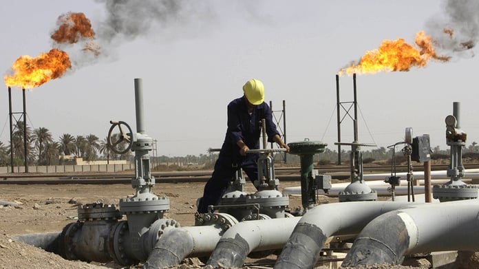 Iraqi oil worker at a refinery near Basra as Turkey and Iraq sign the Kirkuk-Ceyhan pipeline deal