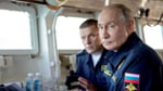Russian President Vladimir Putin chairs a security meeting as Russia warns Japan that its drone investment in Ukraine constitutes a hostile act against Moscow