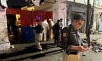 Police officials inspect the site of a suicide bombing at Kabal police station in Swat district Pakistan