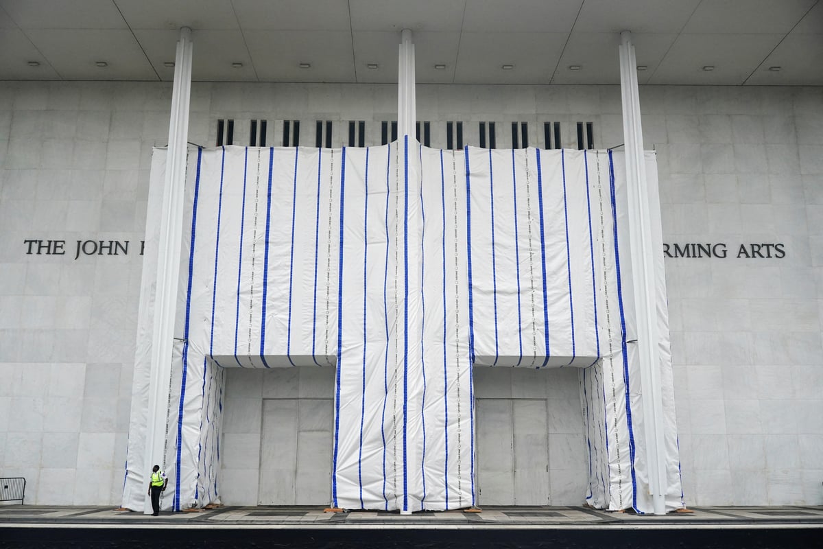 A tarp covers the facade of the John F. Kennedy Center for the Performing Arts after a federal judge ordered Trump name removed June 2026