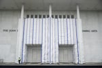 A tarp covers the facade of the John F. Kennedy Center for the Performing Arts after a federal judge ordered Trump name removed June 2026