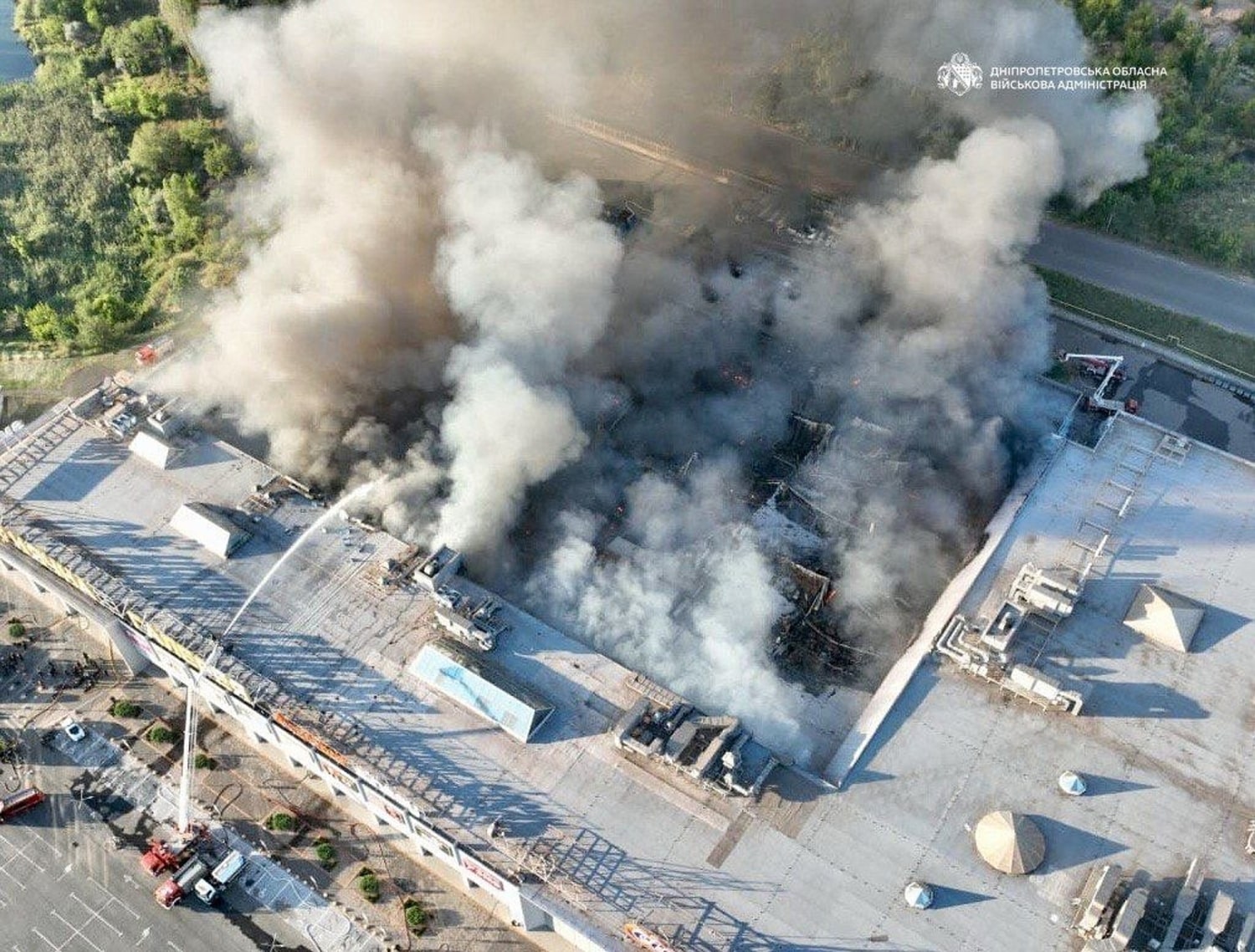 Firefighters tackle a blaze at the Sunny Gallery shopping centre in Kryvyi Rih after a Russian drone attack