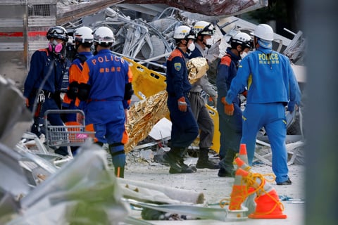 Rescue workers conduct search operations at the damaged Aeon Mall in Kashima Town, Kumamoto, Japan after the 7.1-magnitude earthquake