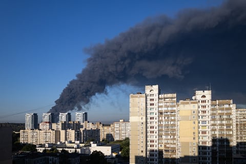Black smoke billows over residential buildings in Kyiv western suburbs after Russian drone struck ammunition warehouse in Myla village August 28 2026
