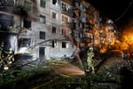 Firefighters work at site of apartment building hit by Russian missile strike in Kyiv Ukraine August 1 2026