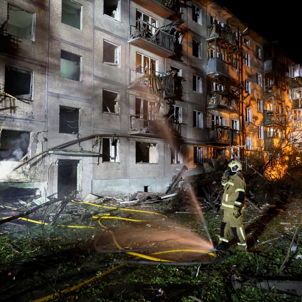 Firefighters work at site of apartment building hit by Russian missile strike in Kyiv Ukraine August 1 2026