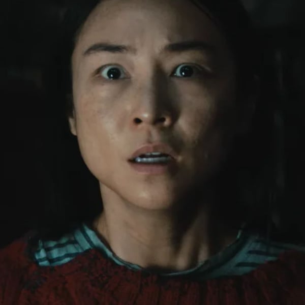 Greta Lee as Ann looking shocked inside the sealed house in Netflix thriller The Last House