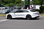 Lucid Air 2022 electric vehicle in light metallic finish shown at an automotive showcase
