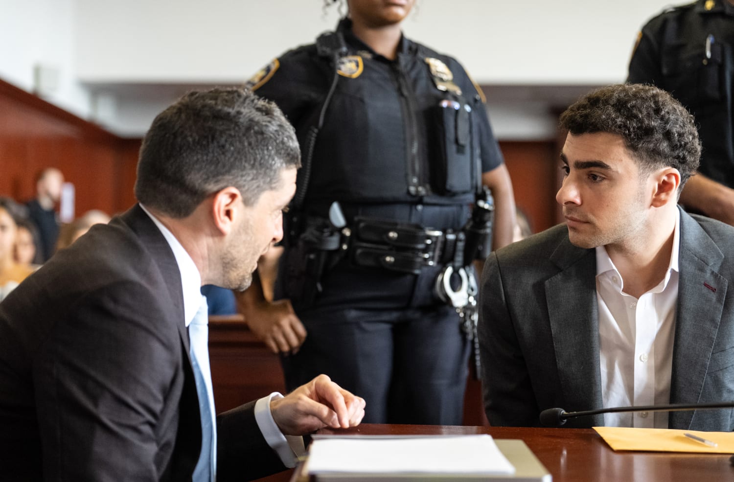 Luigi Mangione confers with attorney Jacob Kaplan at Manhattan federal court during guilty plea hearing August 2026