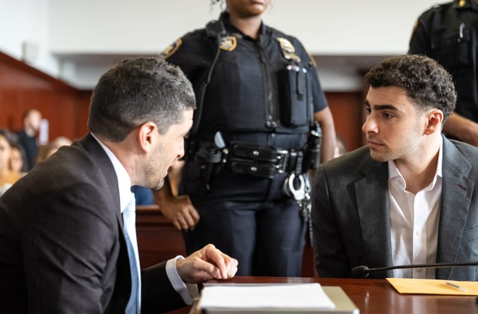 Luigi Mangione confers with attorney Jacob Kaplan at Manhattan federal court during guilty plea hearing August 2026