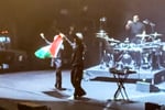 Massive Attack members Robert Del Naja and Grant Marshall perform at a concert before being detained by Singapore police for raising a Palestinian flag