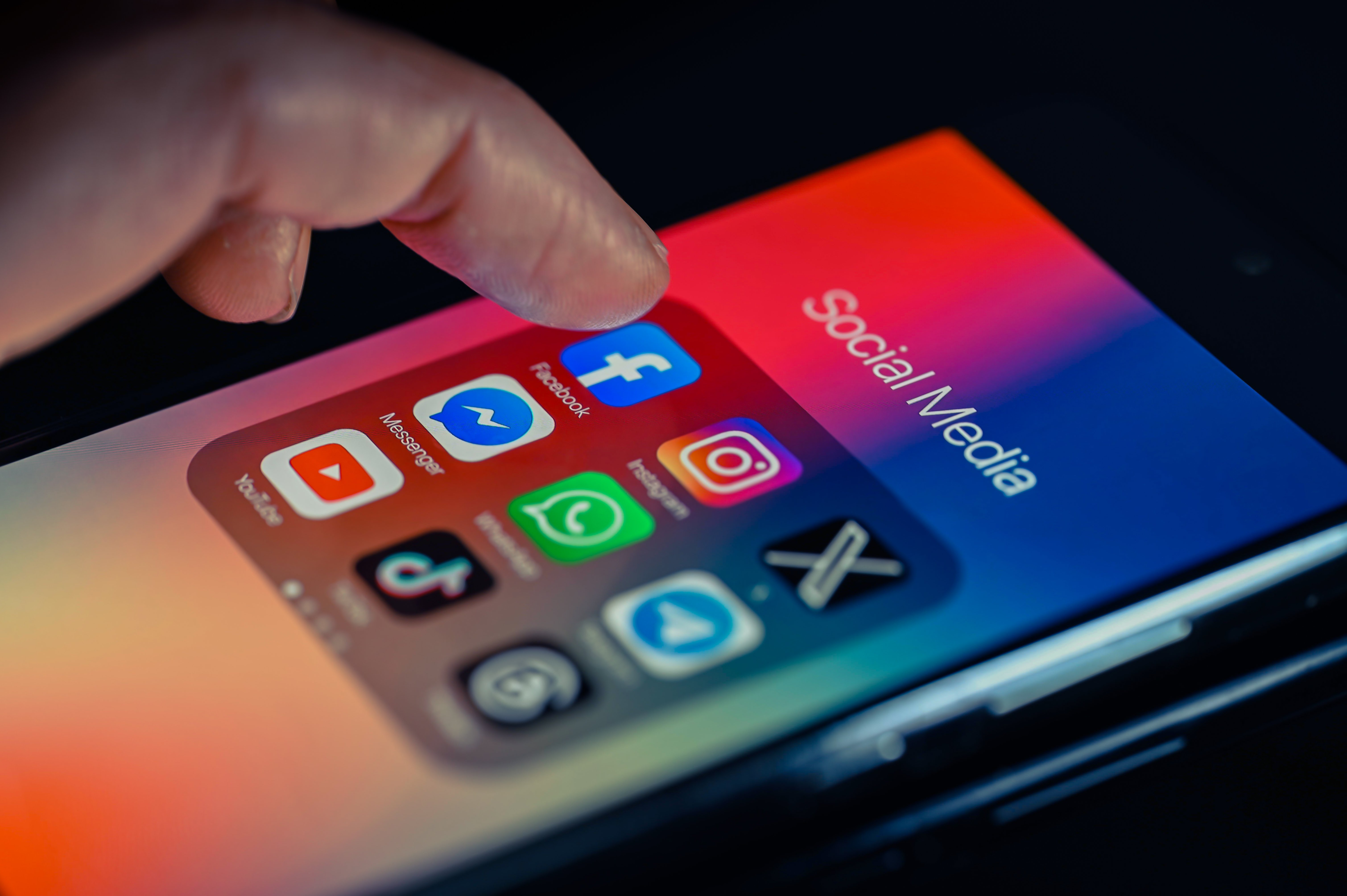 Meta, TikTok, Snapchat, and Google social media app icons on a phone screen