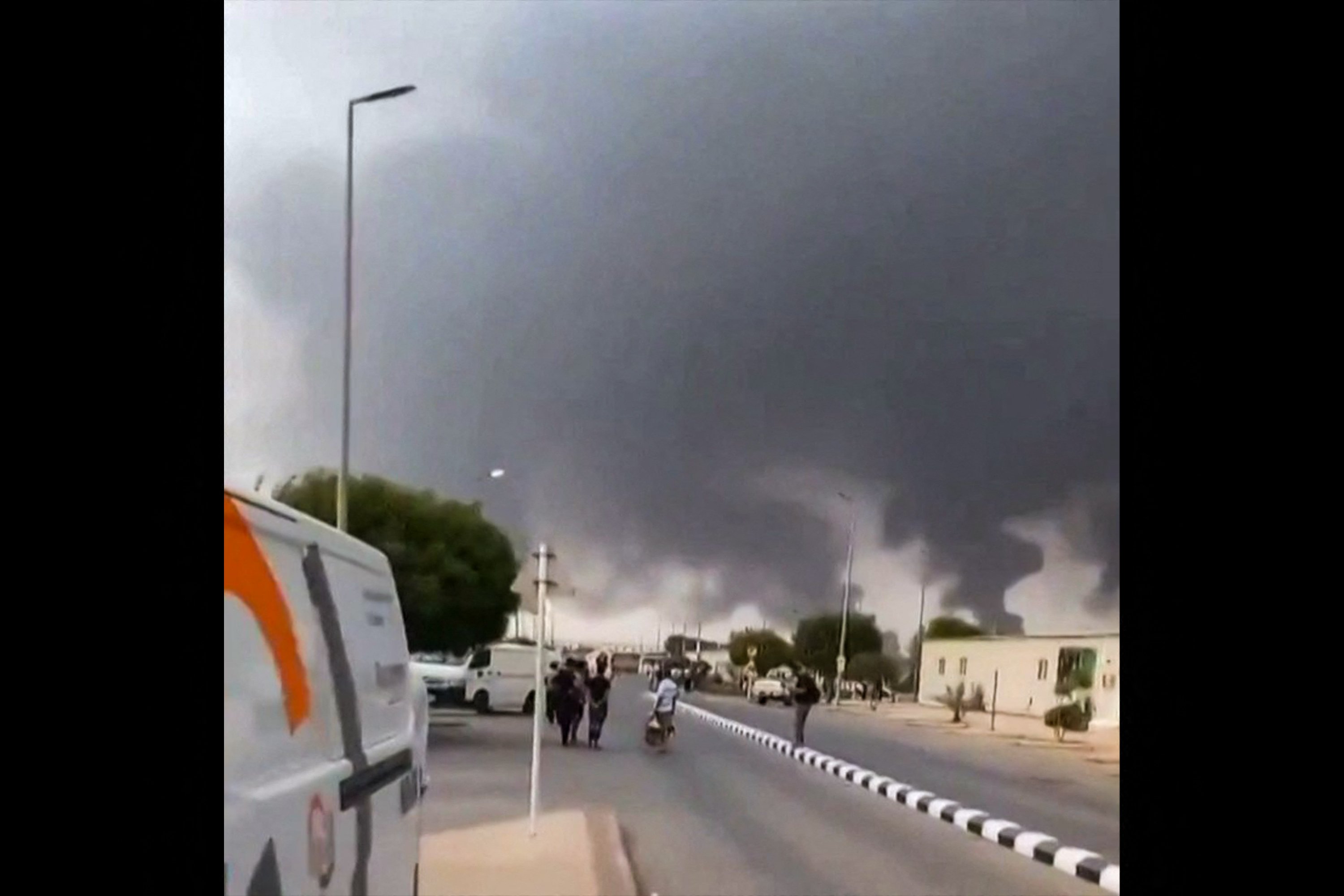 Smoke rises from Saudi Arabia energy infrastructure as Middle East conflict drives crude oil prices above 100 dollars in 2026