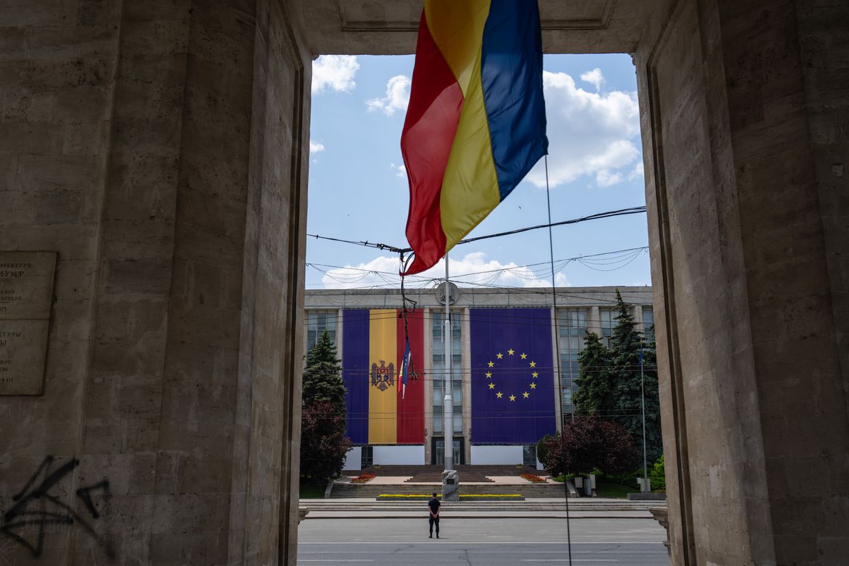 Moldovan and European Union flags displayed at the Government House of Moldova in Chisinau, symbolising the country's EU accession candidacy announced in June 2022