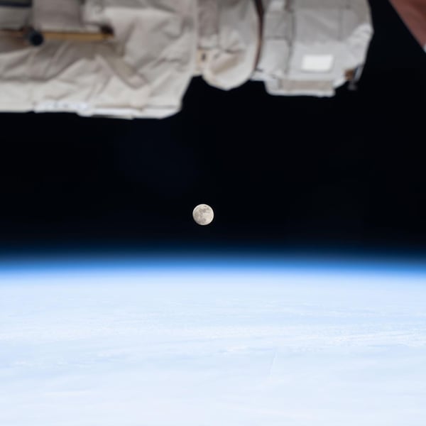 The moon phase today is a waxing gibbous, seen from the International Space Station above the blue band of Earth's atmosphere