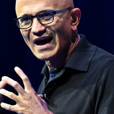 MSFT stock today: Microsoft chief executive Satya Nadella speaking on stage as Azure passes 100 billion dollars in annual revenue