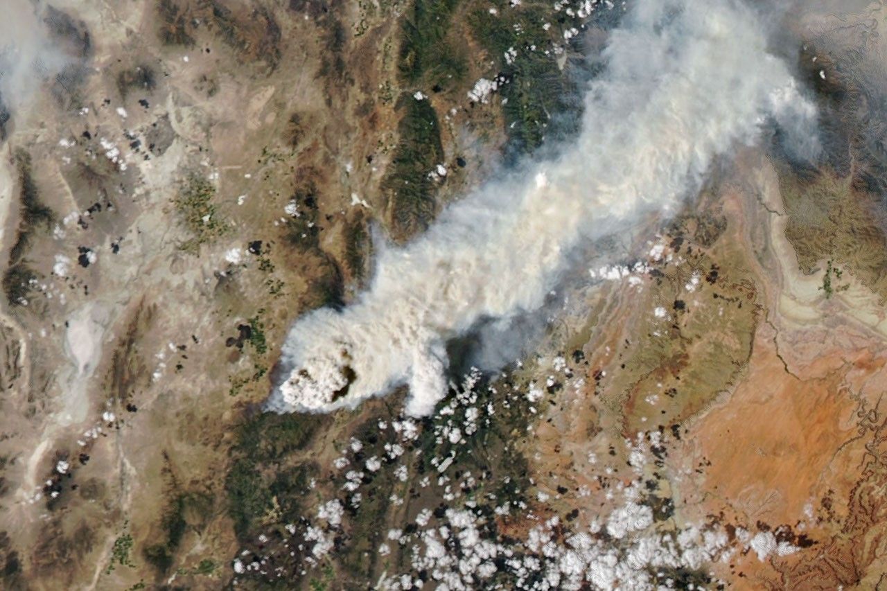 NASA MODIS satellite natural color image of pyrocumulonimbus cloud system over western United States wildfires in August 2026
