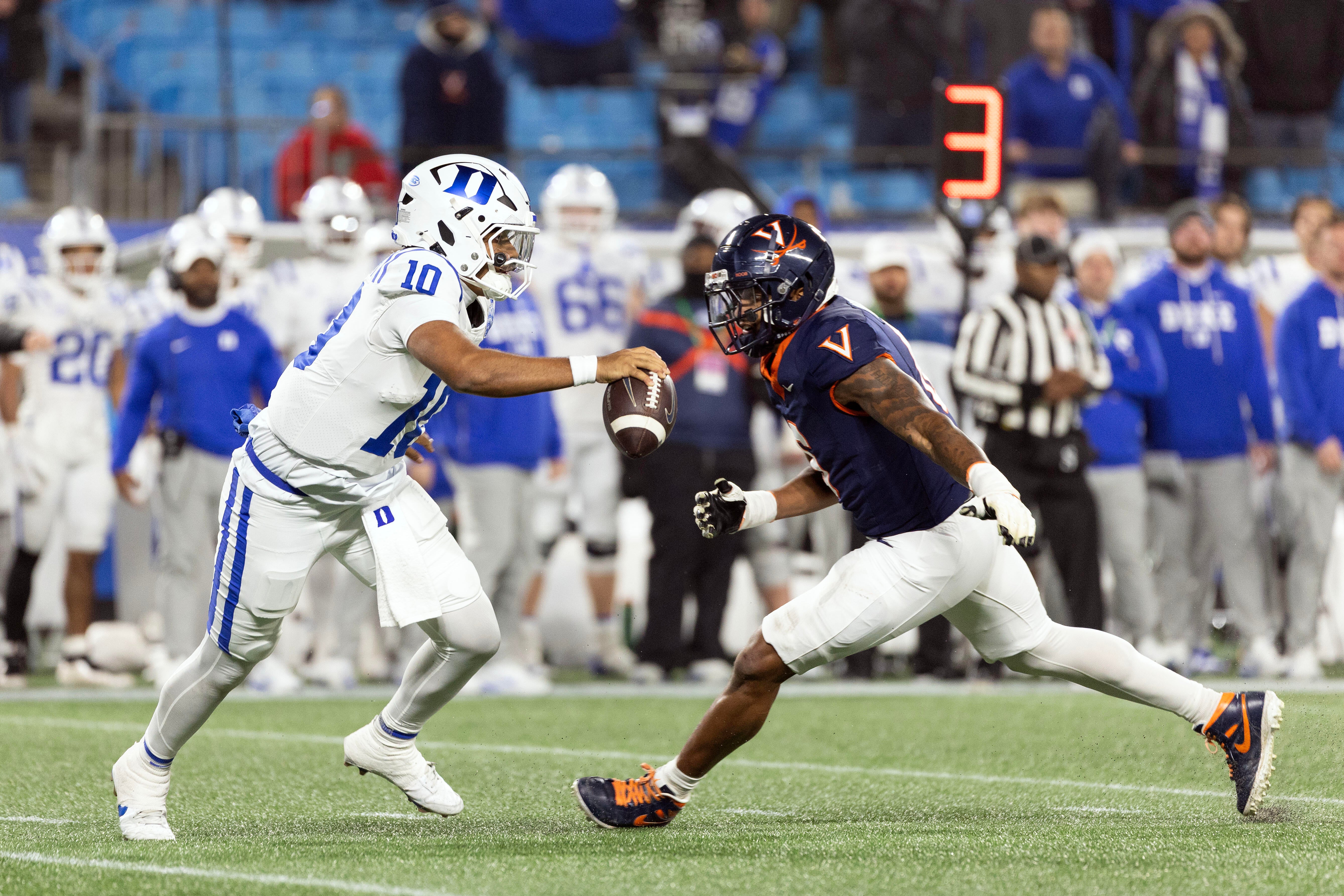 College football players on the field, as a court ruling grants 2022 class athletes a fifth year of eligibility