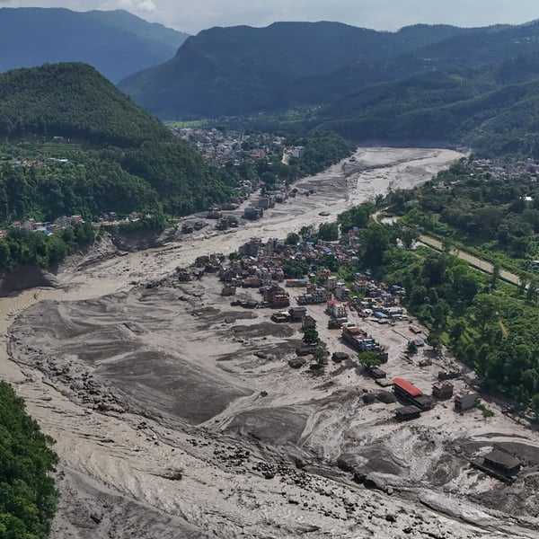 Damaged houses beside the debris-choked Trishuli River in Nepal's Nuwakot district after the flash floods