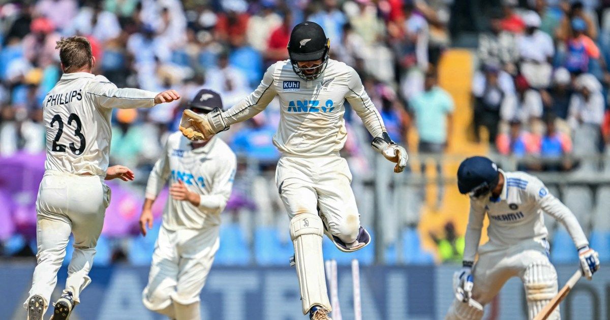 New Zealand players celebrate the 25-run win over India in the third Test at the Wankhede Stadium in Mumbai that completed a 3-0 series whitewash