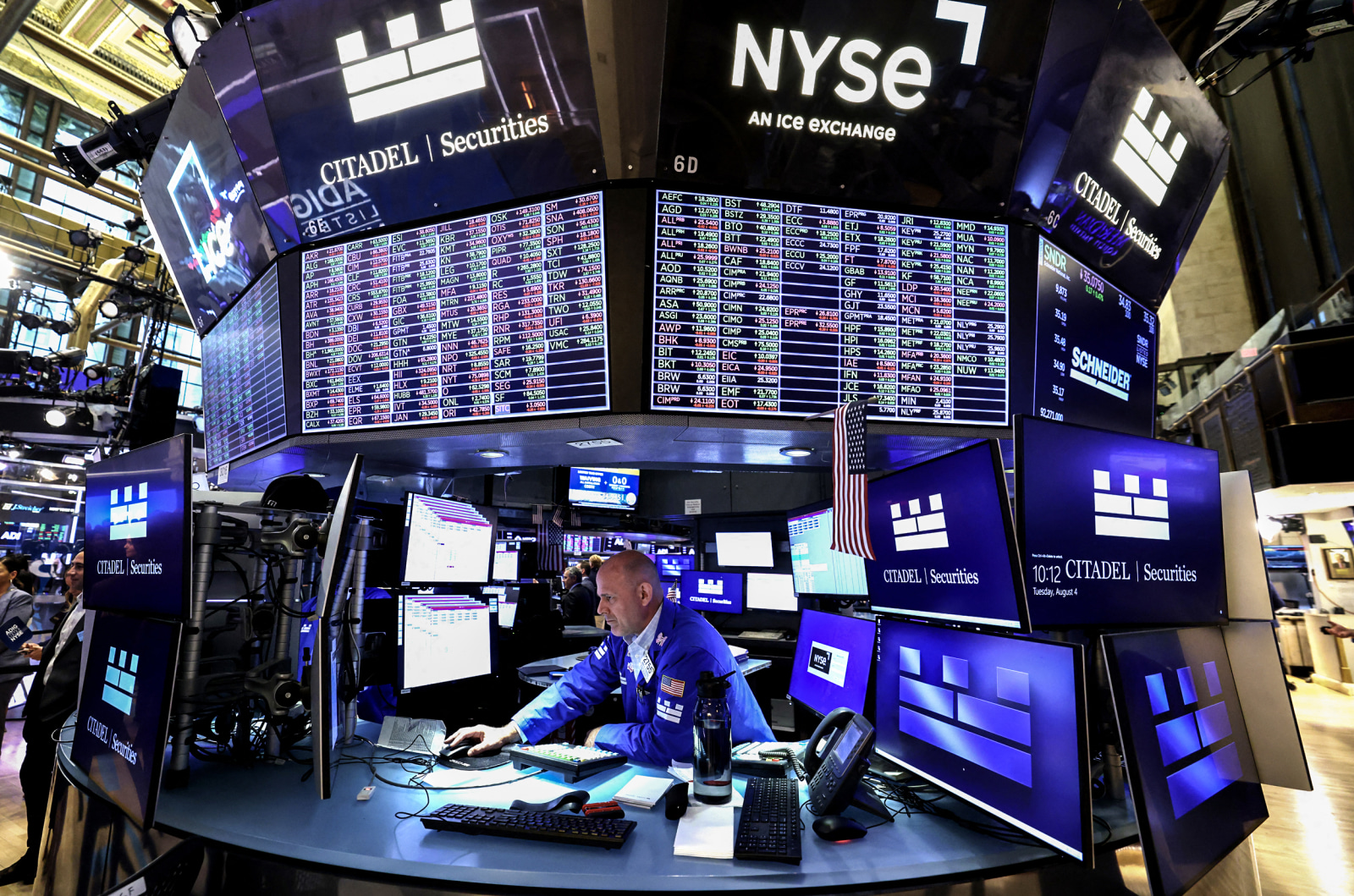 Traders on the floor of the New York Stock Exchange as S&P 500 hits record high on flat July PPI data