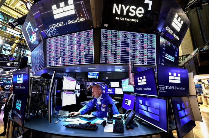 Traders on the floor of the New York Stock Exchange as S&P 500 hits record high on flat July PPI data