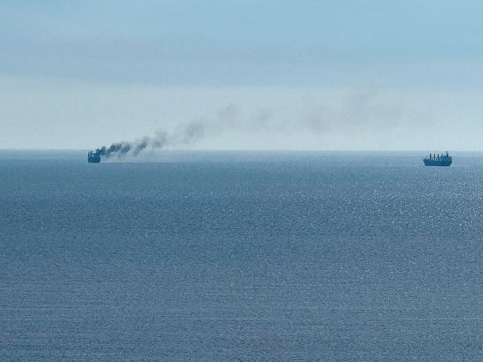 A civilian vessel appears to be on fire near the Black Sea port of Odesa after a reported Russian strike