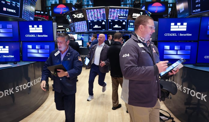 Traders on the floor of the New York Stock Exchange as oil prices today hold Brent crude near $94 a barrel
