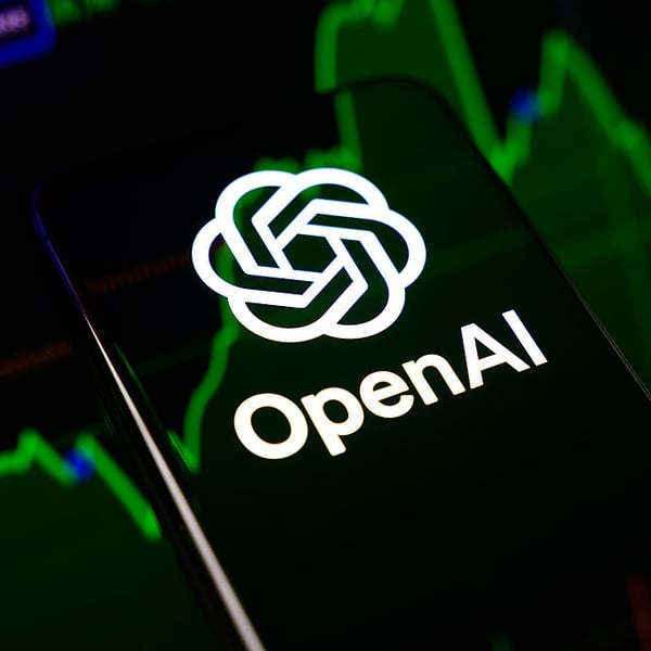 OpenAI logo displayed in green neon on a dark background
