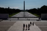 Visitors walk near the drained Lincoln Memorial Reflecting Pool in Washington DC after Trump botched renovation