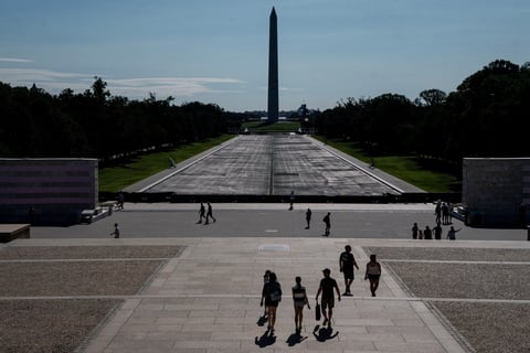 Visitors walk near the drained Lincoln Memorial Reflecting Pool in Washington DC after Trump botched renovation