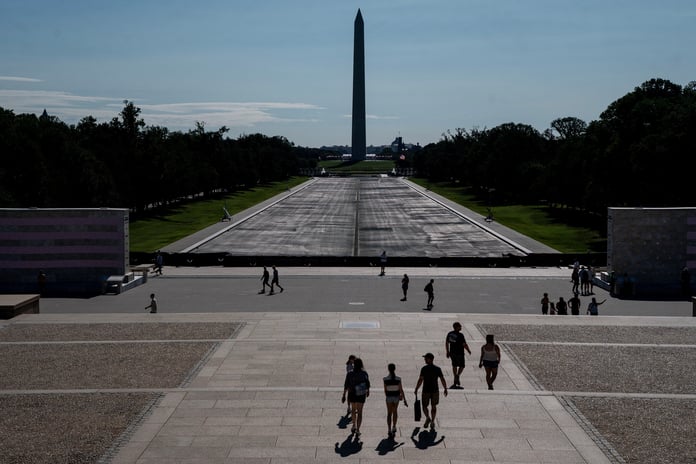 Visitors walk near the drained Lincoln Memorial Reflecting Pool in Washington DC after Trump botched renovation