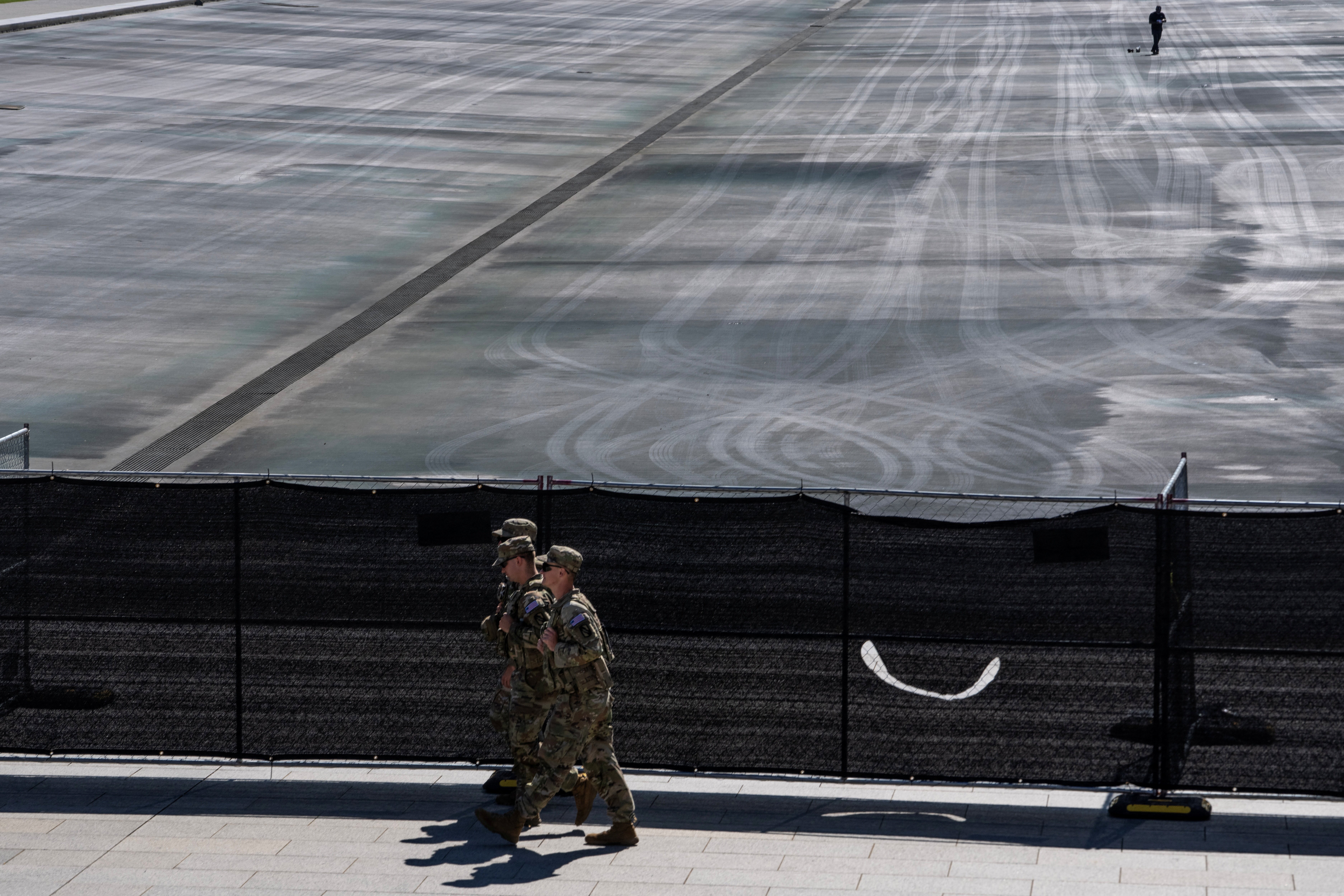 National Guard personnel stand near the Lincoln Memorial Reflecting Pool in Washington DC during the renovation controversy