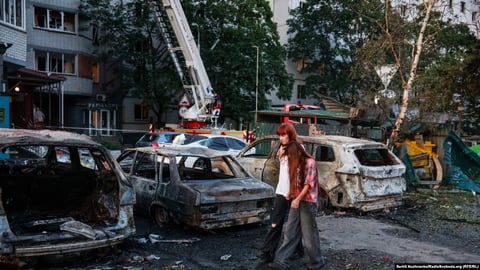 Aftermath of Russian ballistic missile attack on Kyiv August 1 2026 with damaged buildings and emergency responders