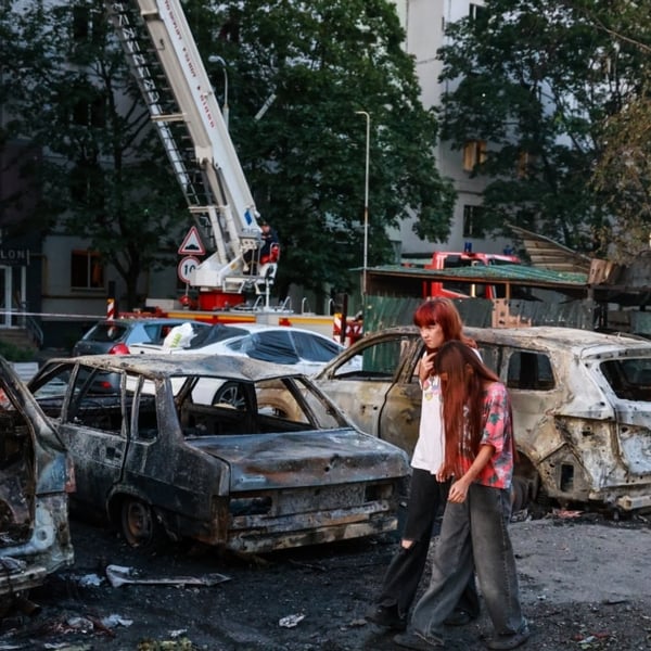 Aftermath of Russian ballistic missile attack on Kyiv August 1 2026 with damaged buildings and emergency responders